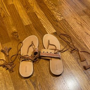 Brand new sandals with leather ties. Worn one time